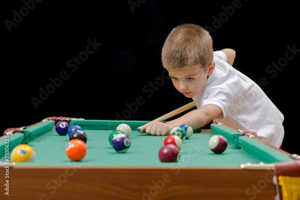 Obraz Beautiful boy playing billiard (pool)