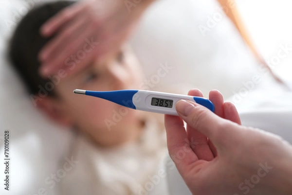 Obraz A little boy has a high temperature.
