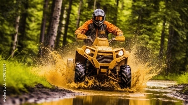 Fototapeta ATV in action splashing water motion blur at trail forest ,