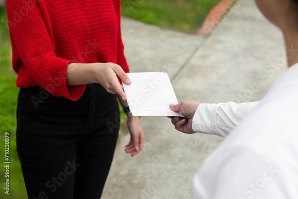 Obraz Hands Exchanging a Blank Leaflet