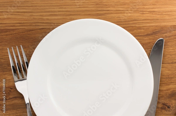 Obraz plate, knife and fork  at cutting board