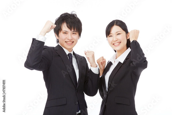 Fototapeta ガッツポーズするビジネスウーマンとビジネスマン