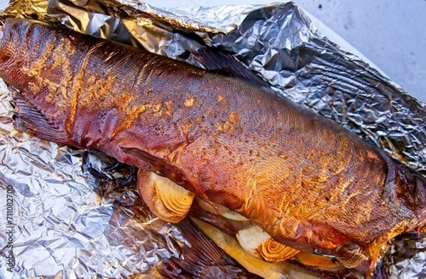 Obraz Whole salmon smoked and grilled with onion and lemon