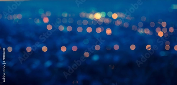 Fototapeta city blurring lights abstract circular bokeh blue background wit