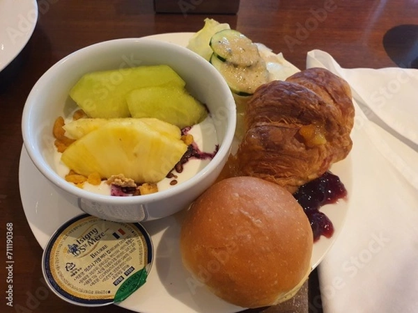 Fototapeta breakfast buffet yogurt, bread pineapple