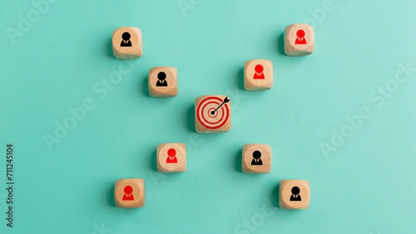 Fototapeta Concept of achieving goals by cooperating with team members with a human icon for customer focus target group and customer relation management concept.