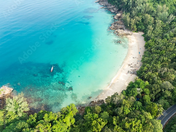 Obraz View from above, stunning aerial view of Banana beach, a beautiful white sand beach surrounded by palm trees and bathed by a turquoise water. Phuket, Thailand.