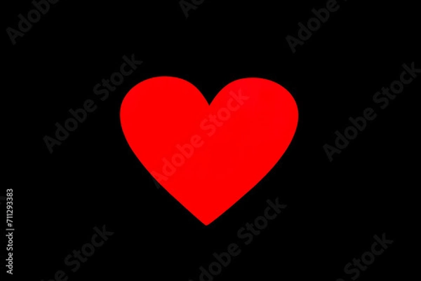 Fototapeta Red neon light shaped into a heart isolated on black background. Beautiful symbol for Valentine's Day for lovers' day on february 14.
