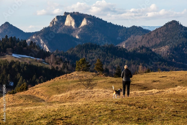 Obraz spending time with a dog during a mountain hike