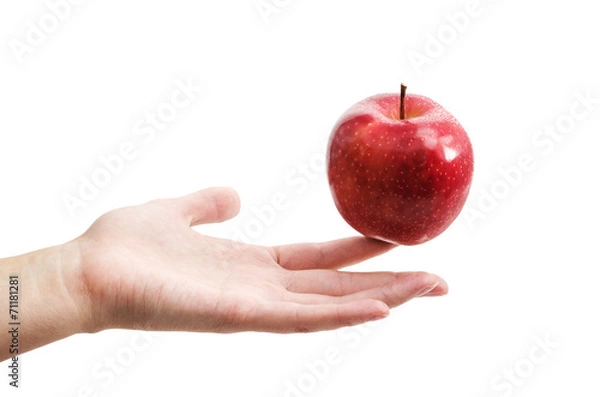 Obraz Рука держит яблоко
