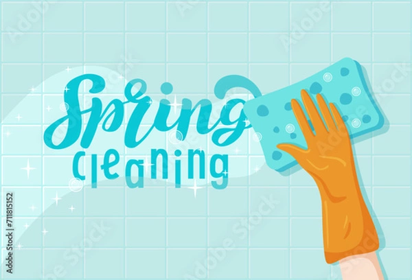 Fototapeta Flat hand cleans smooth surface with sponge on blue background. Vector cartoon illustration with Spring Cleaning lettering for poster or banner. Orange glove cleans tiled wall and clean area sparkles