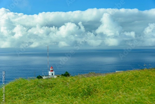 Obraz Lighthouse above the clouds