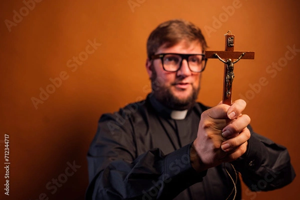 Obraz Portrait of an exorcist priest with crucifix and black shirt.