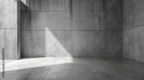 Obraz Simple concrete room with light hitting the floor and the wall at an angle, brutalist architecture. Warmth in brutalism.