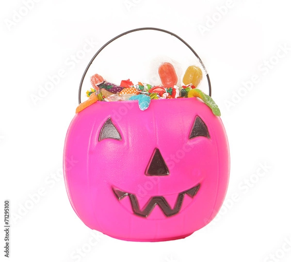 Obraz Pink plastic pumpkin filled with candy 