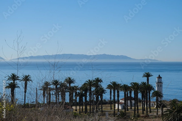Fototapeta Breathtaking scenic and landscape view of coastline of Rancho Palos Verdes with vegetation and cliffs and beautiful bays overlooking ocean and coast in California on sunny blue sky day