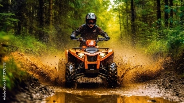 Fototapeta ATV in action splashing water motion blur at trail forest ,
