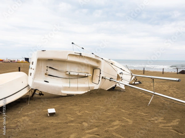 Fototapeta The boat overturned on the beach.