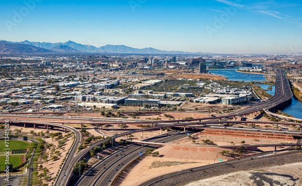 Fototapeta Freeway Interchange aerial view of the Loop 101 and Loop 202 looking West at Tempe and Phoenix, Arizona in 2024