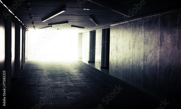 Obraz Abstract dark underground corridor interior with glowing end