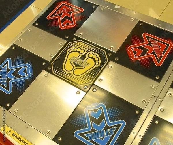 Obraz Dance Dance Revolution pad closeup in arcade