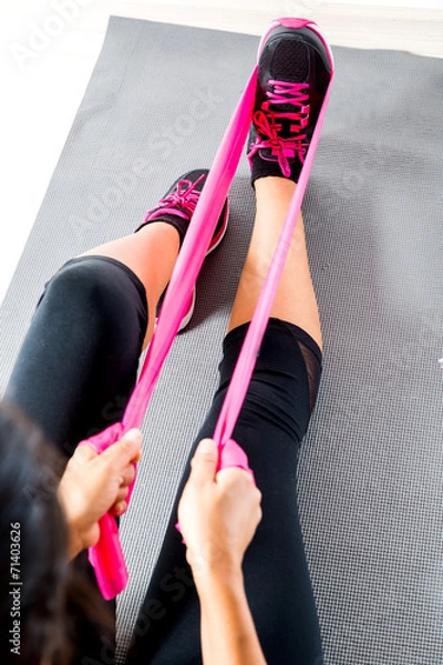 Obraz Doing pilates with stretching bands