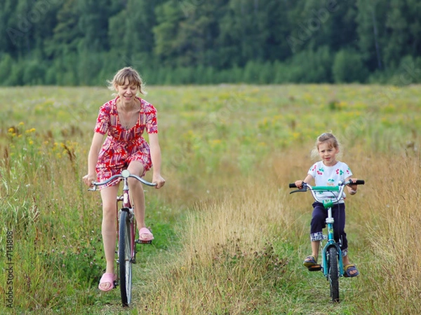 Fototapeta Driving on bicycles