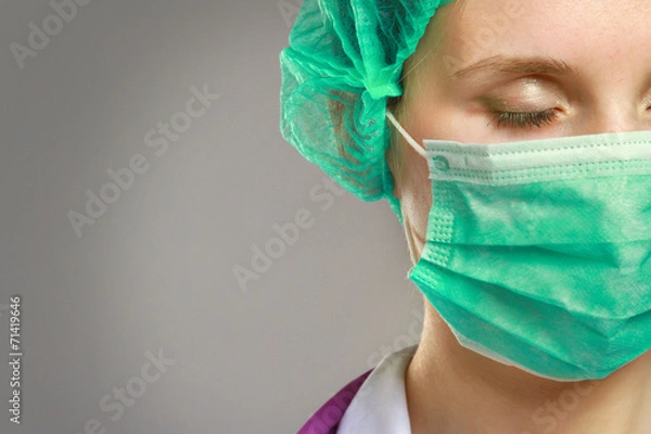 Obraz Medical doctor woman in uniform with stethoscope