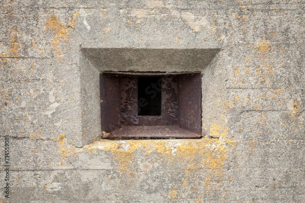 Obraz Rusted loophole in old concrete bunker wall