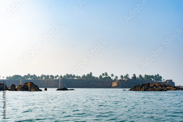 Fototapeta view of Sindhudurg fort  from ocean and blue sky 