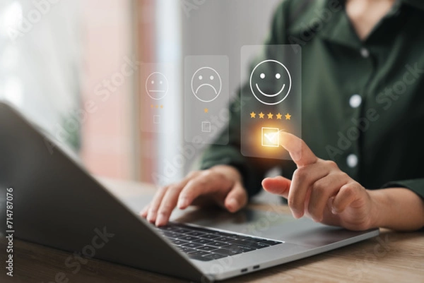 Fototapeta customer satisfaction survey concept businesswoman use laptop Touch the happy smiley icon. Satisfied. 5 stars. Service experience rating. online application Satisfaction Review best quality.