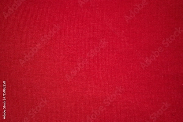 Obraz Knitted red background. Knitted knitted fabric is red. Red background