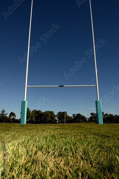 Obraz Goal Posts set against a blue sky.