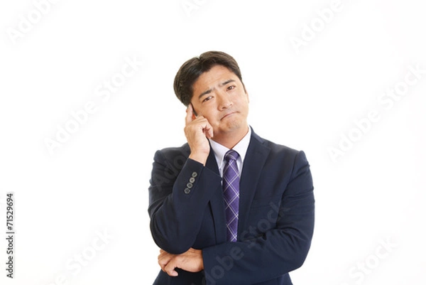 Fototapeta 困惑した表情のビジネスマン