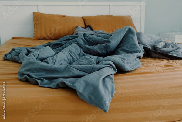 Fototapeta Close up image of bed with bed clothes and pillows. Housekeeping concept