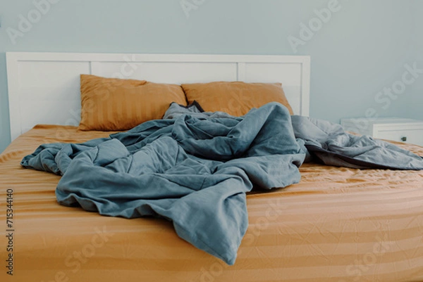 Fototapeta Close up image of bed with bed clothes and pillows. Housekeeping concept