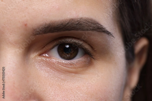 Fototapeta Closeup view of woman with beautiful eyes
