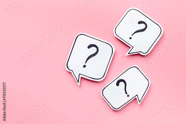 Fototapeta Question marks on paper speech bubbles, top view. Ask and answer concept