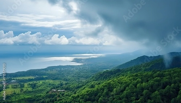 Fototapeta View of the sea of clouds from the top of the mountain peak before storm. Tropical rainforest.