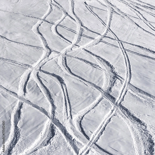 Fototapeta Snowy off-piste ski slope with trace from skis