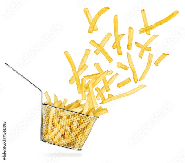 Obraz French fries flying out of falling stainless steel fryer basket isolated on white background.
