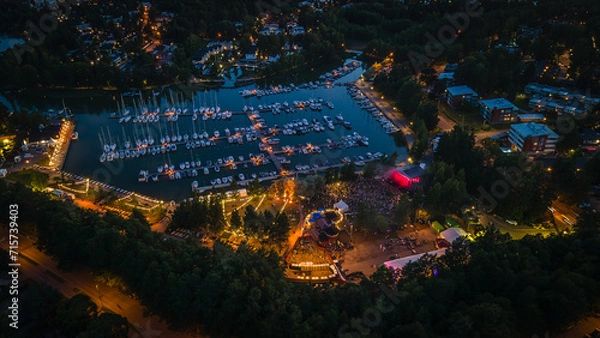 Obraz Evening aerial view of a festival in Espoo with colorful lights
View to dock with reflecting sunset sky