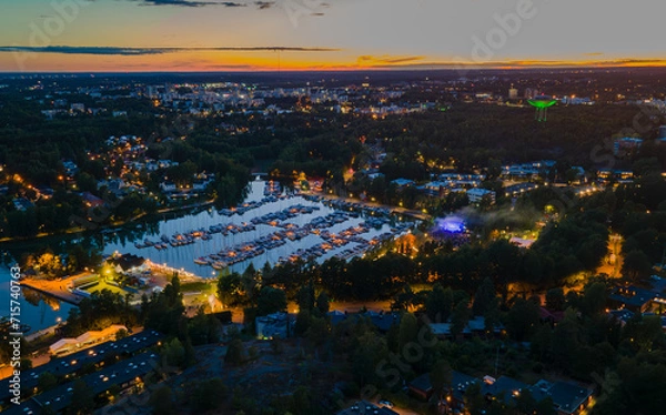 Obraz Evening aerial view of a festival in Espoo with colorful lights
View to dock with reflecting sunset sky