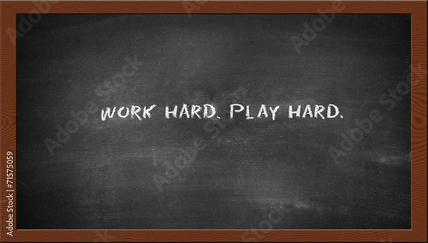 Fototapeta work hard play hard text on the chalkboard