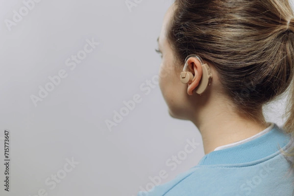 Fototapeta man with a hearing aid on a white background in a shirt without a face