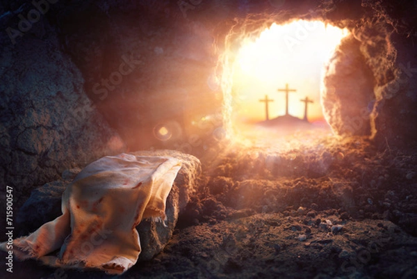 Obraz Resurrection Of Jesus Christ  - Empty Tomb -  Focus On Shroud And Defocused Crosses On Background With flare Lights Effects
