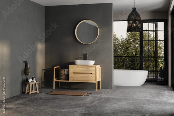 Fototapeta Modern bathroom interior with dark walls, ceramic basin with mirror, bathtub and grey concrete floor. Minimalist black bathroom with modern furniture and big windows, yard.