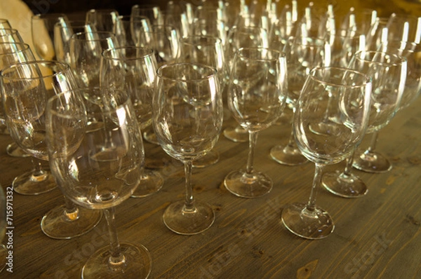 Fototapeta Empty crystal glasses on a wooden table. Bar and Restaurants