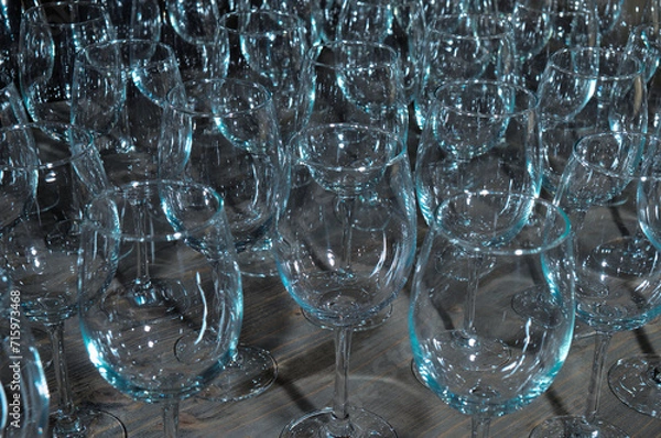 Fototapeta Empty crystal glasses on a wooden table. Bar and Restaurants