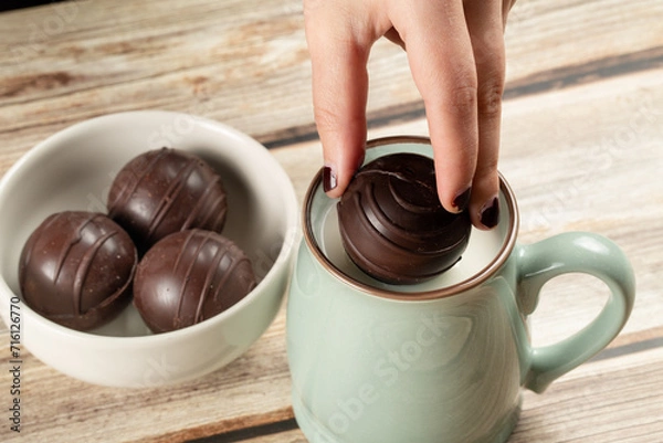 Obraz Dropping hot chocolate ball into milk